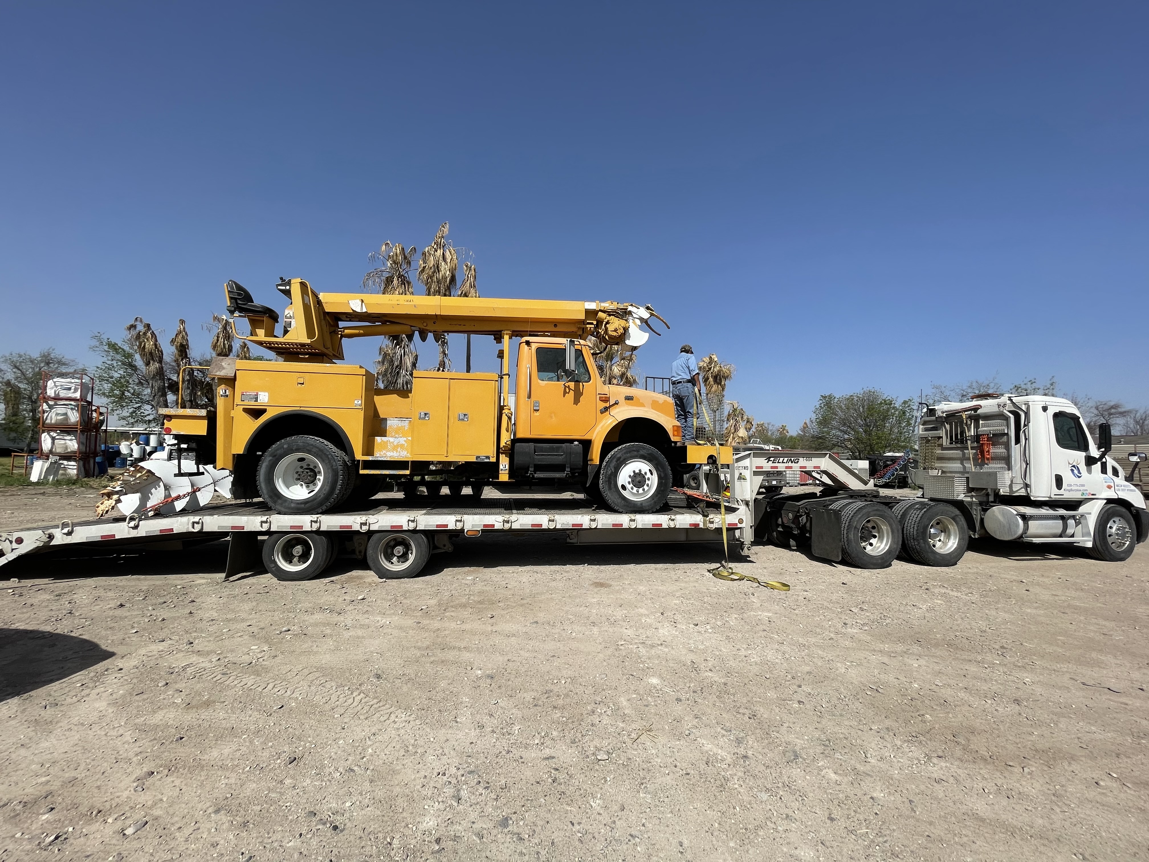 Bucket truck on lowboy